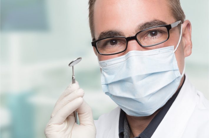 The dentist gives instructions for proper dental hygiene.