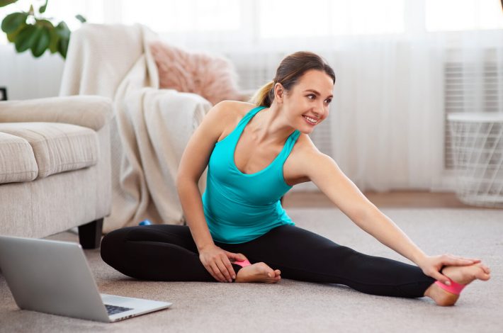 woman stretching at home
